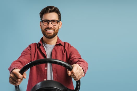 Portrait of handsome, positive, happy Hispanic man wearing stylish eyeglasses, holding helm photo