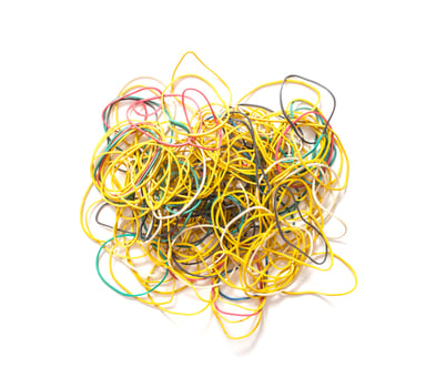 Many multi-colored rubber bands for money on a white background, isolate. Stationery concept photo