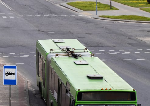 Long accordion bus for transporting people. Mounting system and tail mechanism of the bus, industry photo