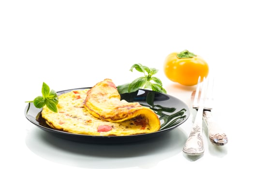 fried omelette with sweet pepper and vegetables in a plate, isolated on white background . photo