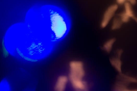 Blurred lens flare. Defocused colorful lights. Shiny glowing spots, abstract background and texture photo
