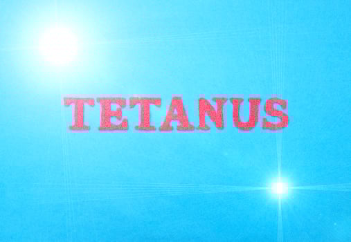 Word tetanus in red letters on a blue background. The concept of a deadly disease of the neural system with convulsions. Treatment and vaccination against tetanus, therapy photo