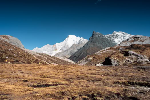Landscape of golden arid field with limestone mountain and blue sky near milk lake photo