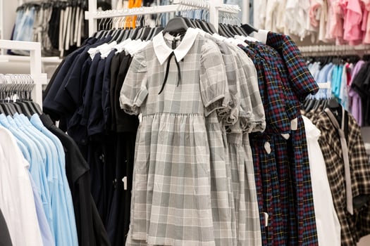 Contemporary Fashion Boutique Display Featuring Trendy Plaid Dress photo