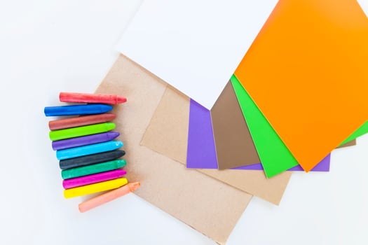 Colored crayons on paper background. photo