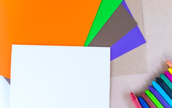 Colored crayons on paper background. photo