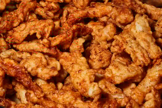 a close up of a bowl of fried chicken photo