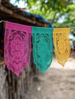 Colorful lace decorations hanging on clothesline photo