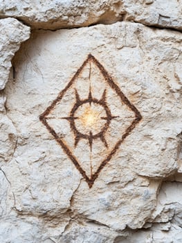 ancient rock carving with abstract symbol photo