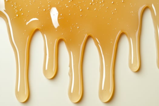 Dripping honey texture background photo