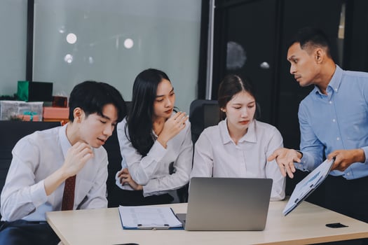 Frustrated upset multiracial business team people sad with bad work result in report disappointed in corporate bankruptcy failure crisis worried of paperwork problem sit at table at office meeting photo