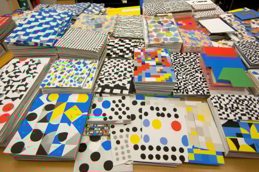 Stacked Papers with Geometric and Abstract Patterns photo