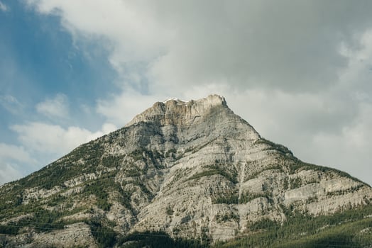 Closeup of snowcapped Haddo Peak mountain top as viewed from Morant's Curve at Lake Louise in Banff National Park, Alberta, Canada.. photo