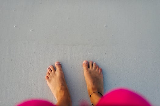 Beautiful traces with feet on sea nature background. photo