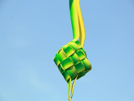 As a celebratory dish, ketupat is packaged in organic green packaging and can be served at Islamic celebrations such as Eid al-Fitr photo