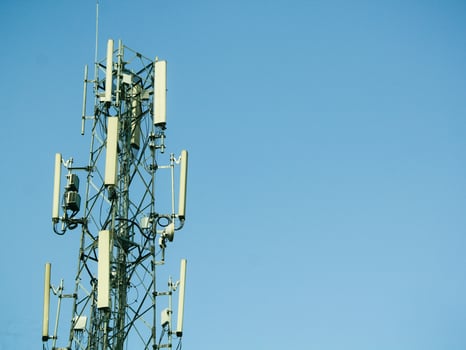 telephone signal catcher tower with a beautiful sky background photo
