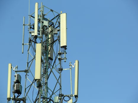 telephone signal catcher tower with a beautiful sky background photo