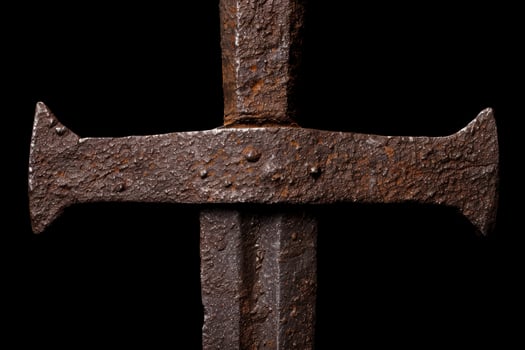 Rusty medieval sword on black background photo