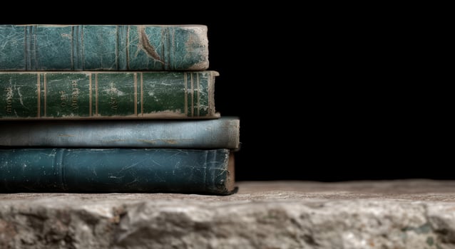 Vintage books stacked on a wooden table photo