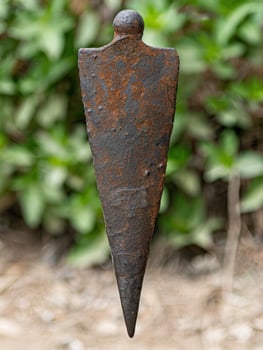 Rusted metal sculpture in nature photo