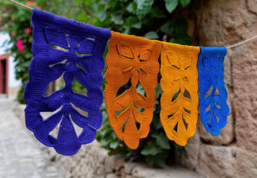 Colorful handmade textile art pieces hanging on a clothesline photo