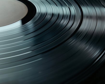 Closeup view of vinyl record grooves photo