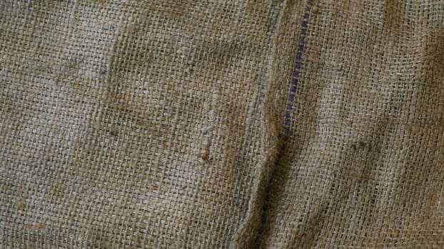 A rustic burlap isolated white background, perfect textured backdrop for showcasing vintage DIY craft products katalog, copy space photo