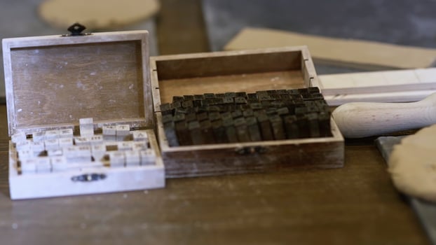 A beautiful collection of vintage wooden letterpress printing blocks and boxes for art and craft. Stock Clip photo
