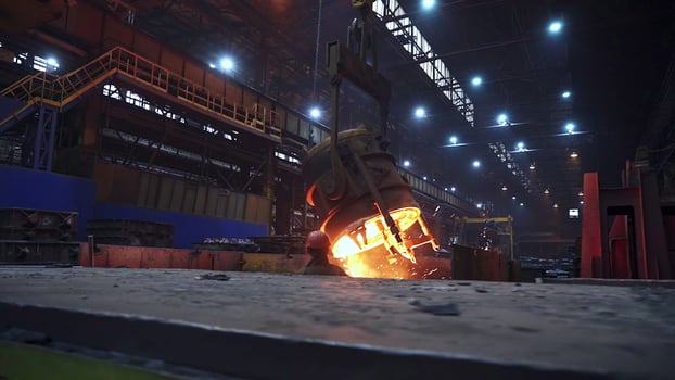 A glimpse into an Industrial Foundry showcasing the impressive process of Molten Metal in Action. Stock Clip photo