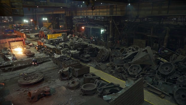 An abandoned industrial factory interior featuring various machinery covered in dust. Stock Clip photo