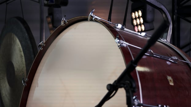 A Detailed Close Up of a Bass Drum and a Gong Set Against a Vibrant Musical Setting. Clip photo