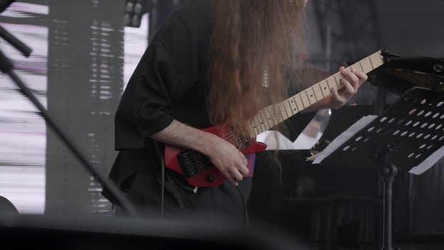 Georgia, Tbilisi - June 17, 2024. Witness a dynamic and captivating guitar performance at an amazing live music event. Clip photo