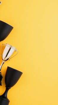Trophy collection on yellow background displaying achievements in various competitions and events photo
