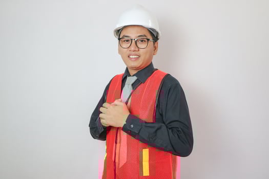 Asian Engineer standing outdoor on site construction posting confident , Engineer construction happy job success with in target planning. photo