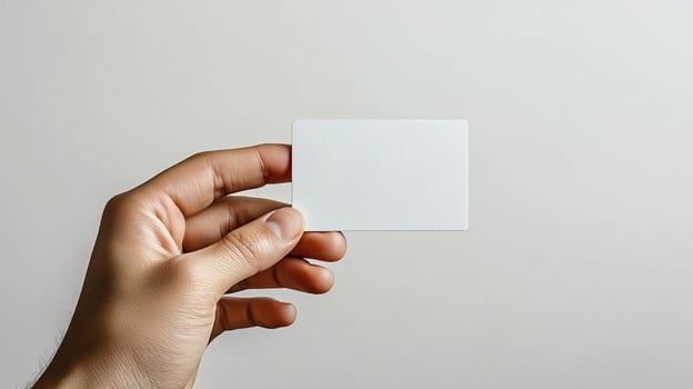 hand holding a blank white card photo