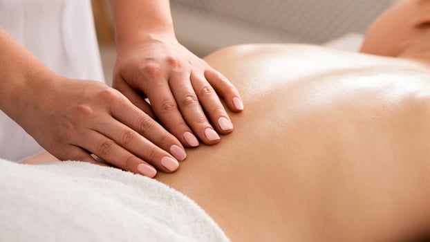 Nude girls backs during spa massage on table photo
