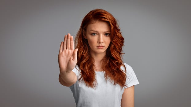 Stay At Home. Determined Girl Gesturing Stop Forbidding And Warning About Danger Posing Over Gray Studio Background. Panorama photo