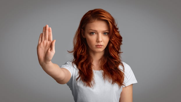 Teen Girl Gesturing Stop Warning And Forbidding Something Standing On Gray Studio Background. Panorama photo