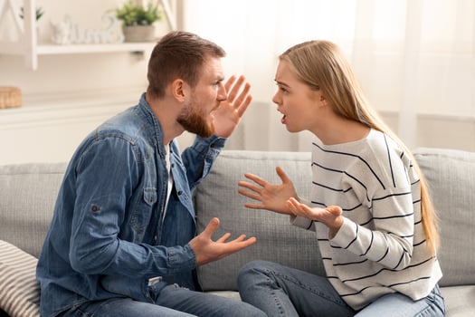 Relationship problem. Emotional man and woman quarreling because of family money photo