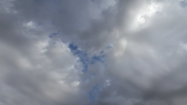 Beautiful dark dramatic sky with stormy clouds before rain or snow. Thunderstorm heaven landscape. Timelapse. photo