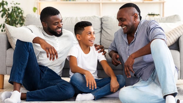Family. Grandfather, Father And Son Sitting On Floor At Home, Resting, Enjoying Spending Time Together, Free Space photo