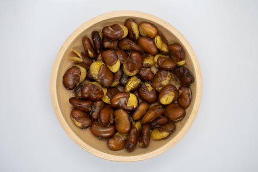 Koro beans in a wooden bowl on a white background photo
