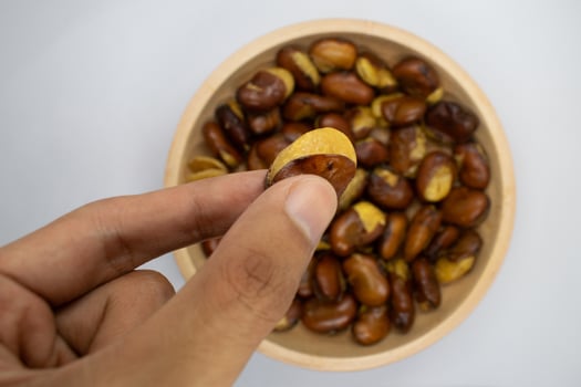A bowl full of koro beans is ready to eat photo