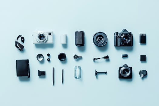 Flat lay of camera and photography accessories on a blue background. photo