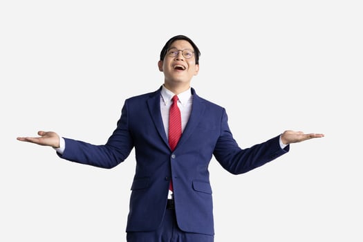 Businessman happy to receive money falling from above isolated on white. Business man gesture happy success wealth income incoming. photo