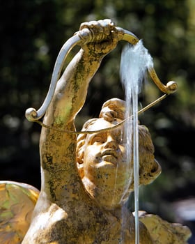 Cupid Archer Sculpture by Water Fountain photo