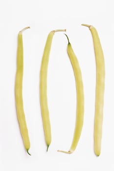 Four Yellow Beans on White Background photo