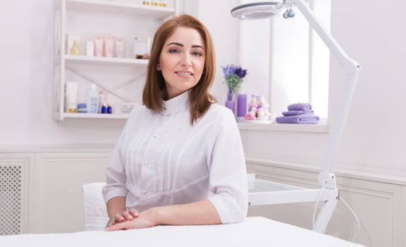 Woman beautician doctor at work in spa center. Portrait of a young female professional cosmetologist. Healthcare occupation, medical career photo