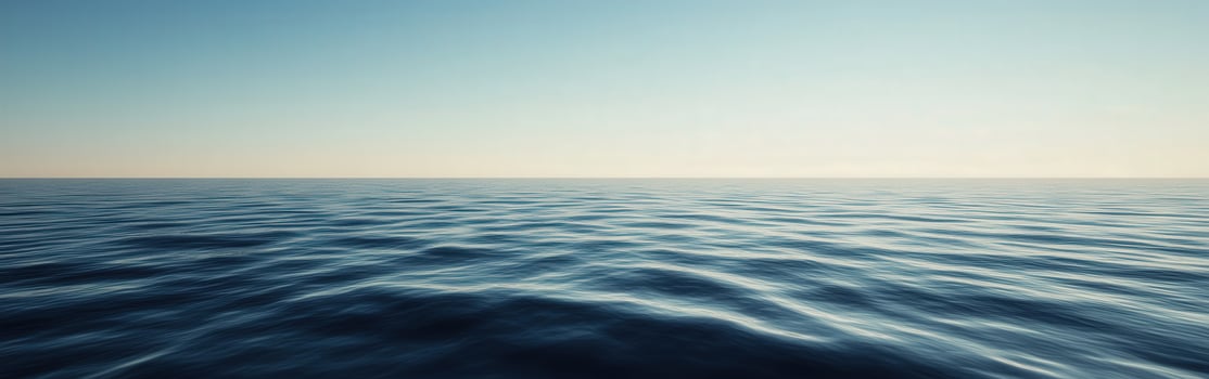 Calm ocean waves under clear blue sky at dawn with horizon view photo