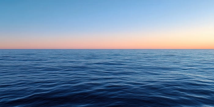 Calming blue ocean waves under a pastel sunset sky at dusk photo
